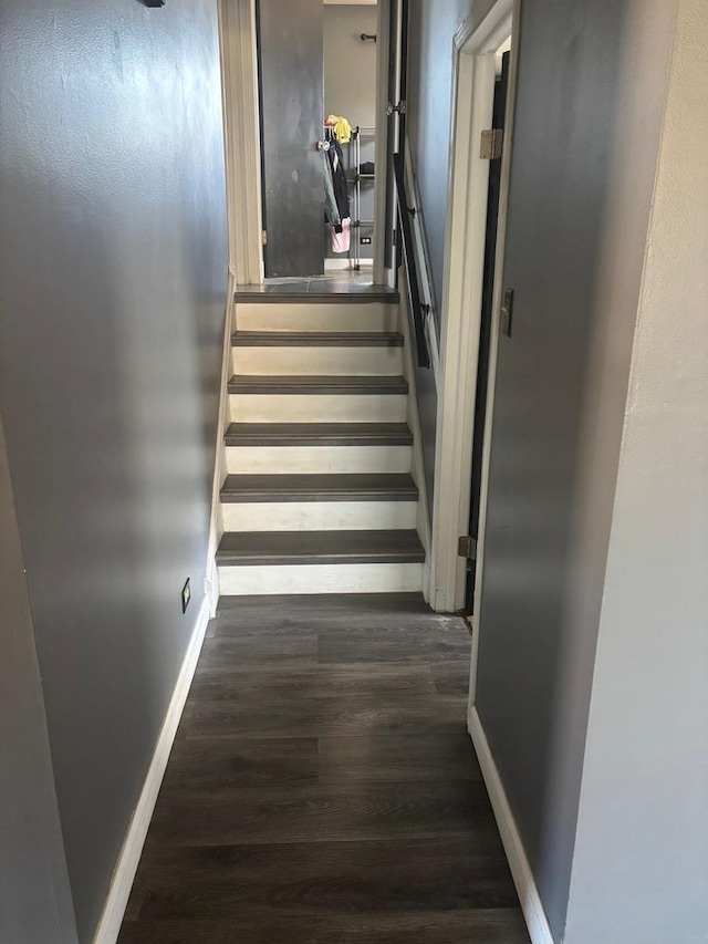 stairs with baseboards and wood finished floors