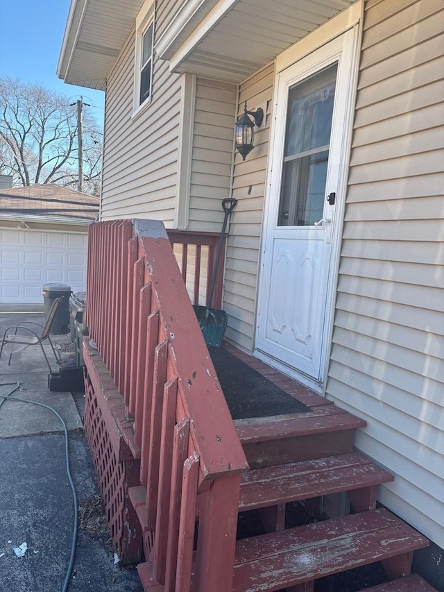 doorway to property with a garage