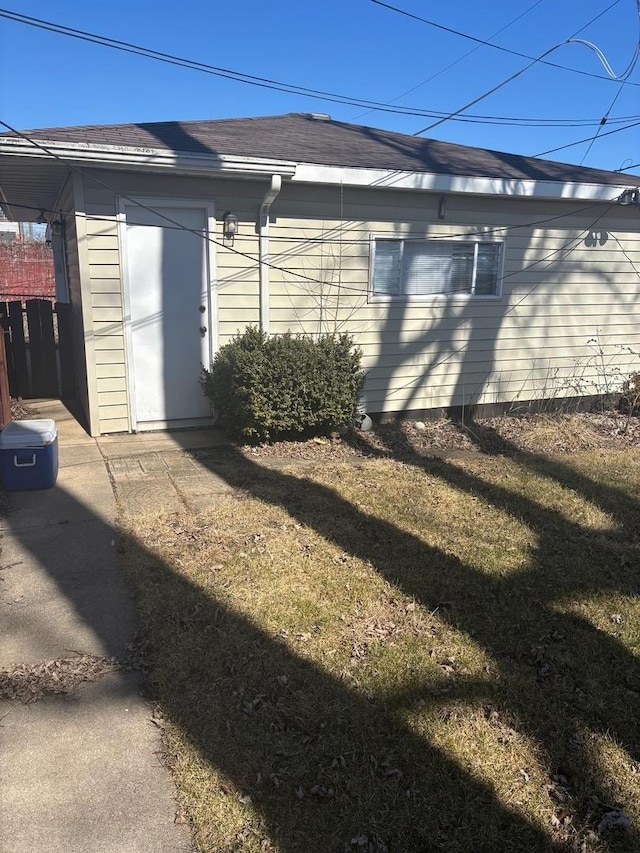 view of side of property with a yard