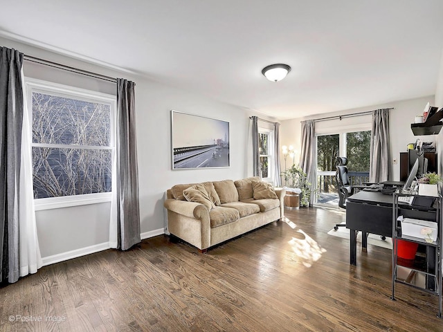 living room with dark wood-style floors and baseboards