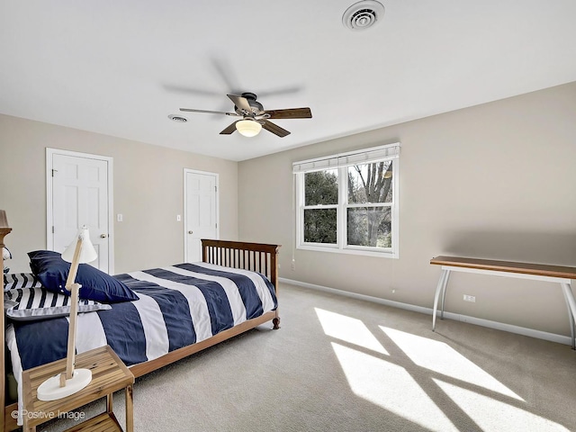 bedroom featuring baseboards, visible vents, and carpet floors