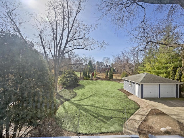 view of yard with a garage and an outdoor structure