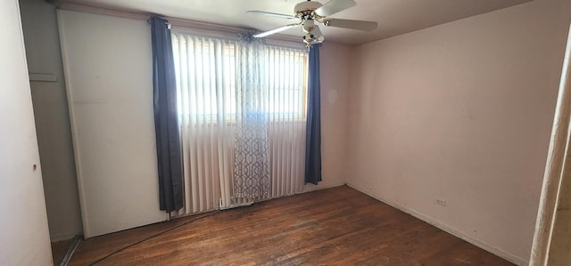 unfurnished room with wood finished floors and ceiling fan