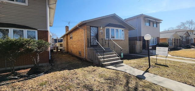 view of front of home featuring brick siding