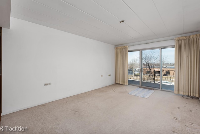 empty room featuring carpet flooring