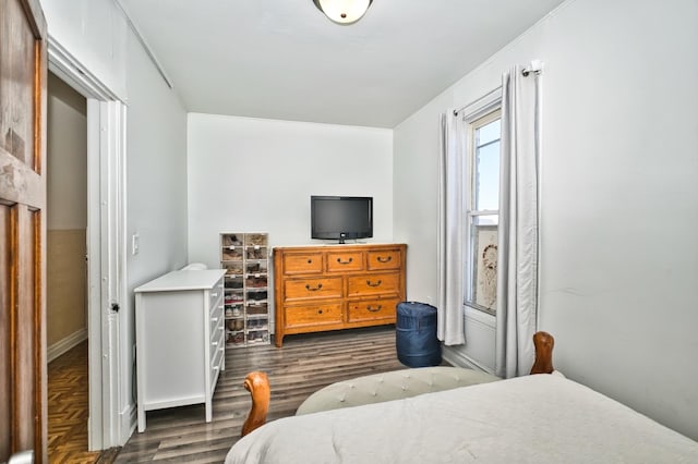 bedroom with wood finished floors