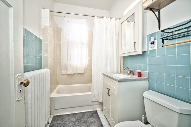 full bath with toilet, radiator, tile walls, tile patterned flooring, and vanity