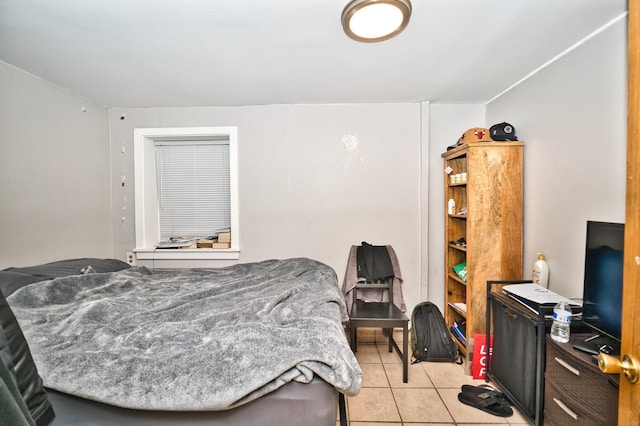 bedroom featuring light tile patterned floors