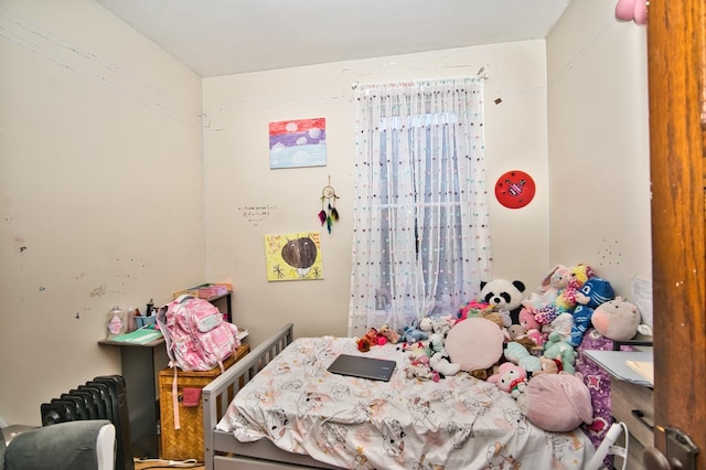 bedroom with radiator heating unit