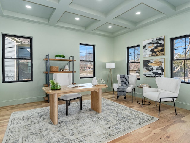 office with a wealth of natural light, coffered ceiling, and wood finished floors