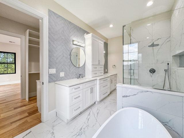 full bath featuring a marble finish shower, recessed lighting, a freestanding tub, marble finish floor, and vanity