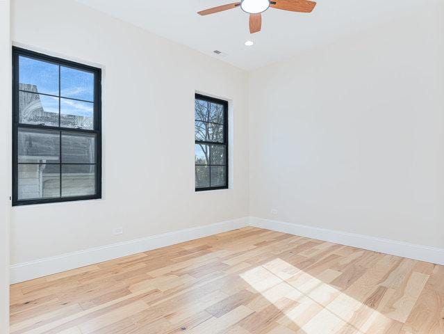 unfurnished room featuring recessed lighting, light wood-type flooring, baseboards, and a ceiling fan