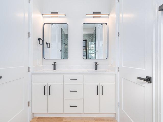 bathroom featuring double vanity and a sink