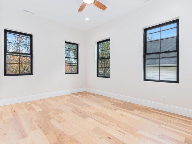 empty room featuring recessed lighting, baseboards, light wood-style flooring, and a ceiling fan