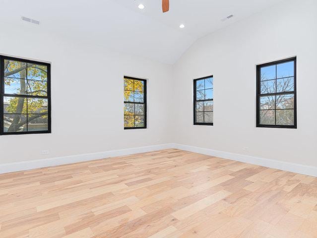 unfurnished room with baseboards, visible vents, recessed lighting, ceiling fan, and light wood-type flooring