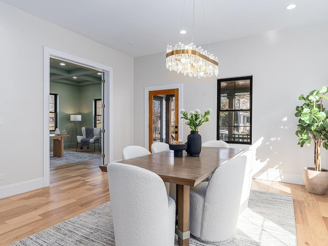 dining area featuring a notable chandelier, recessed lighting, baseboards, and wood finished floors