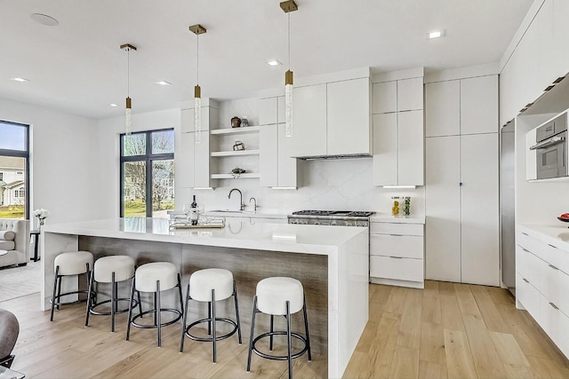 kitchen featuring open shelves, modern cabinets, and white cabinetry