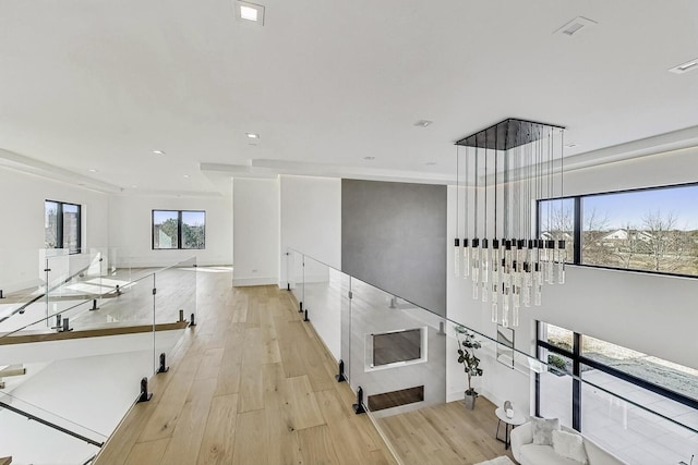 corridor featuring recessed lighting and light wood-style floors