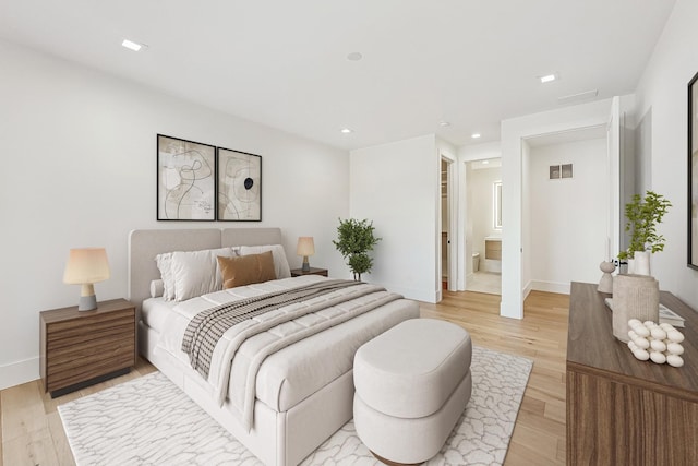 bedroom with visible vents, light wood-style flooring, recessed lighting, connected bathroom, and baseboards