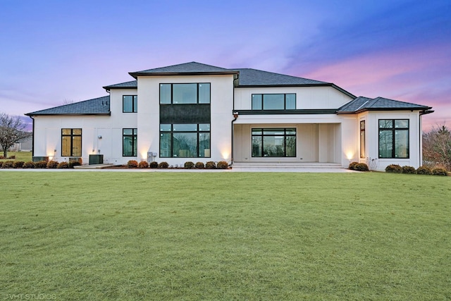 back of house featuring a yard