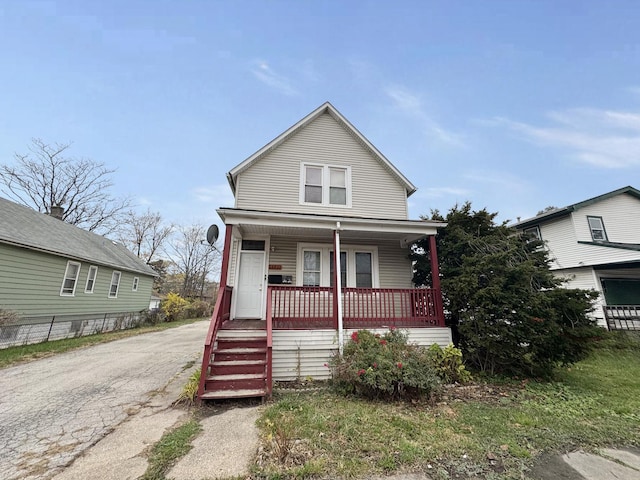 view of front of property with covered porch and driveway