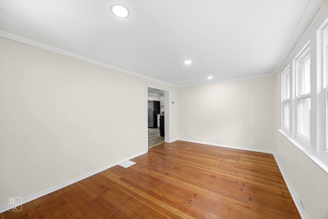 unfurnished room with recessed lighting, baseboards, light wood-style floors, and ornamental molding