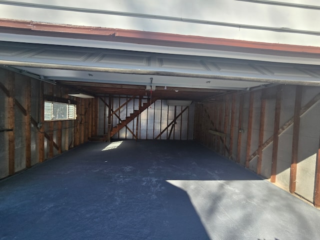 garage featuring wood walls