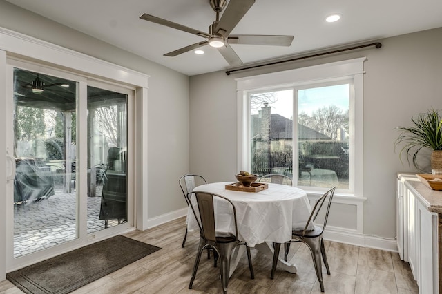 dining space with recessed lighting, baseboards, light wood-type flooring, and a ceiling fan