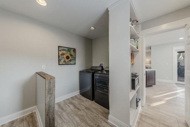 laundry area featuring recessed lighting, baseboards, and independent washer and dryer