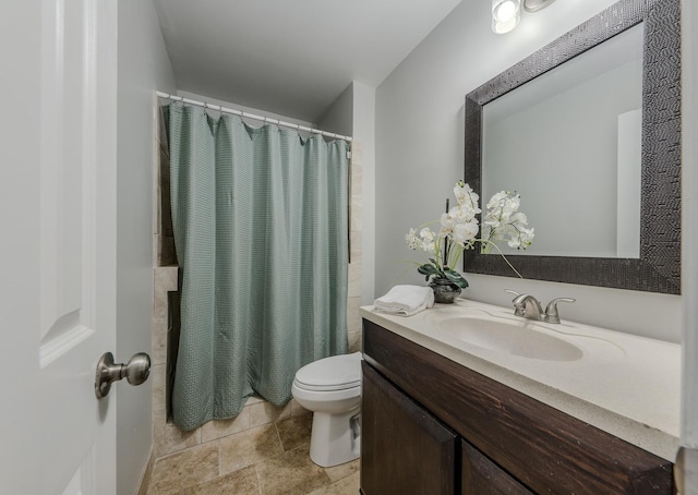 bathroom with vanity, a shower with shower curtain, and toilet