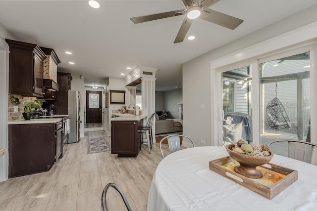 dining room with recessed lighting, light wood-type flooring, and ceiling fan