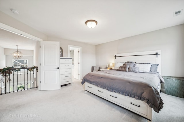 bedroom with light carpet, visible vents, connected bathroom, and a chandelier