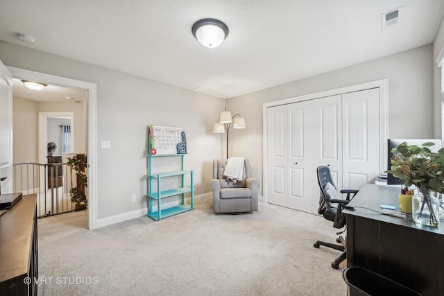 office area with visible vents, carpet floors, and baseboards