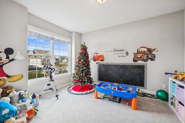 game room featuring baseboards and carpet floors