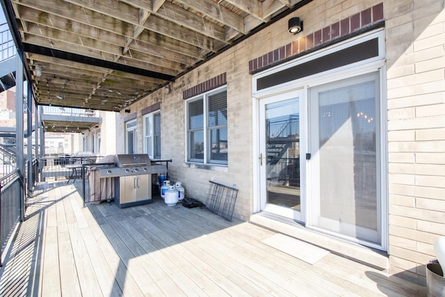 wooden deck featuring grilling area