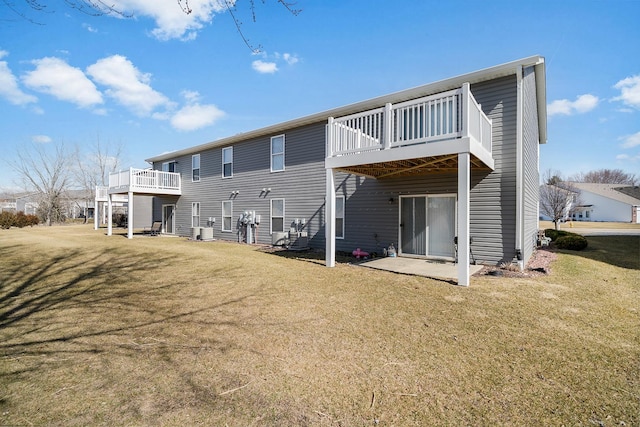 back of property with a yard, central air condition unit, and a deck