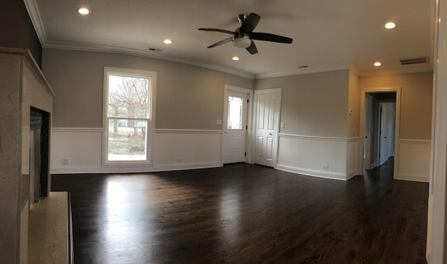 interior space with a ceiling fan, visible vents, recessed lighting, ornamental molding, and dark wood-type flooring