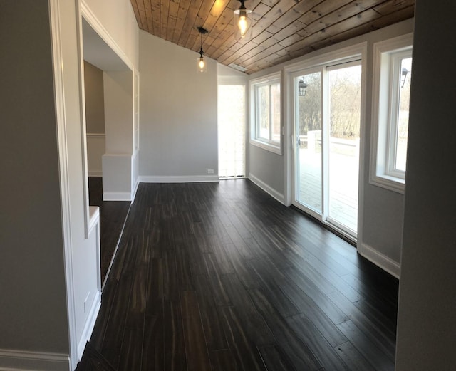 spare room with vaulted ceiling, wood ceiling, dark wood-style floors, and baseboards