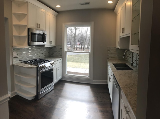 kitchen with visible vents, open shelves, plenty of natural light, a sink, and appliances with stainless steel finishes