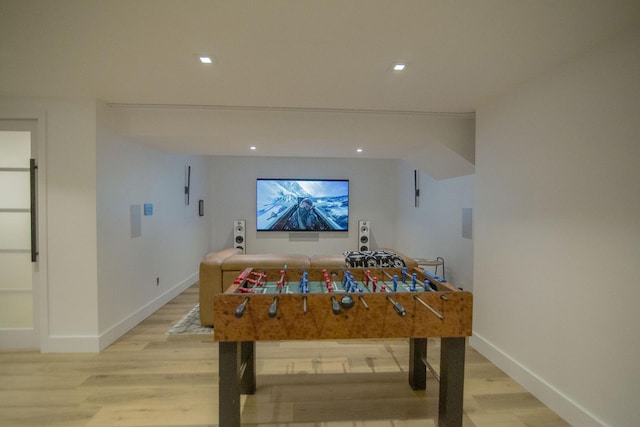 recreation room with light wood-style flooring, recessed lighting, and baseboards