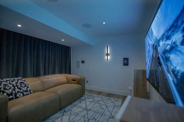 home theater with recessed lighting, wood finished floors, and baseboards