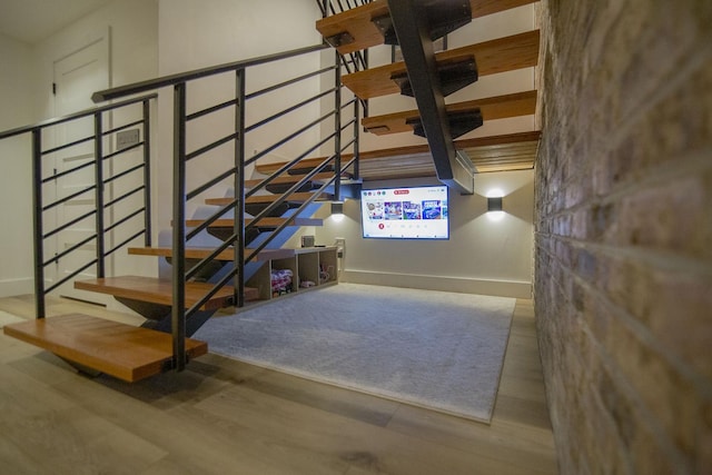 interior space featuring wood finished floors and baseboards