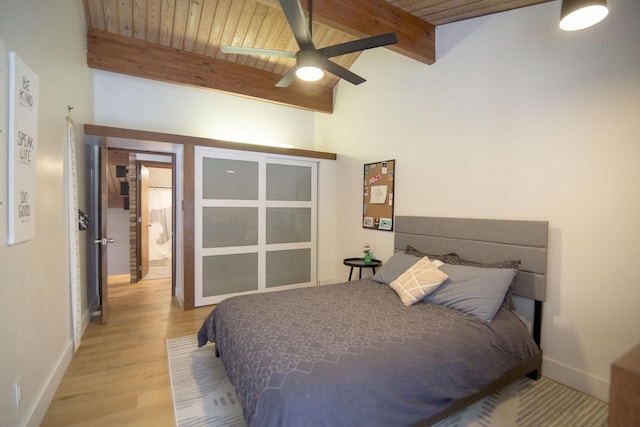 bedroom featuring light wood-style flooring, wooden ceiling, lofted ceiling with beams, and baseboards