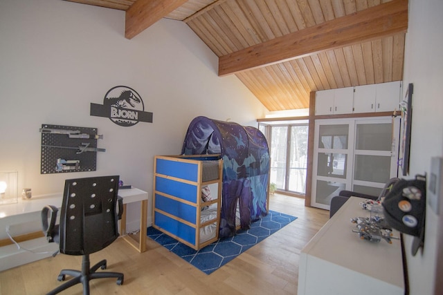 home office featuring lofted ceiling with beams, light wood-style flooring, and wooden ceiling