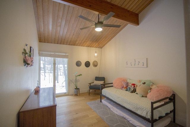 interior space with wooden ceiling, vaulted ceiling with beams, ceiling fan, and wood finished floors