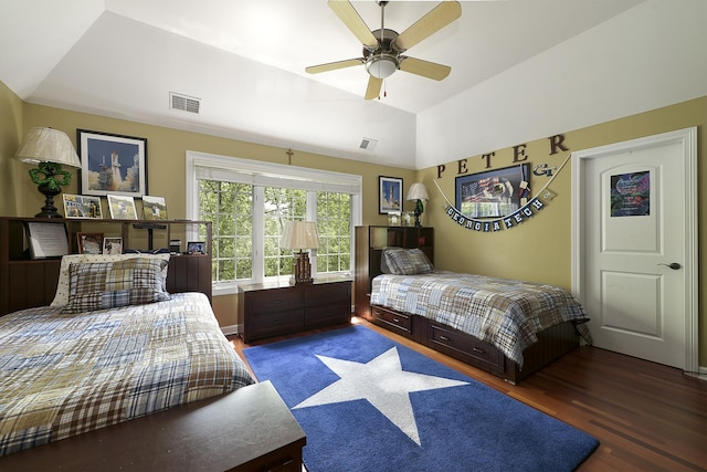 bedroom featuring visible vents, wood finished floors, a ceiling fan, and vaulted ceiling