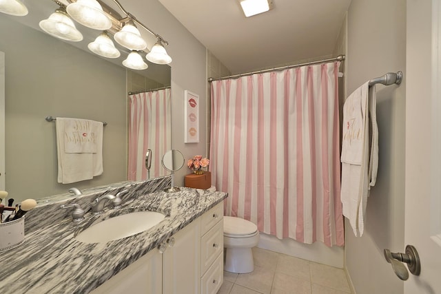 bathroom with tile patterned floors, toilet, and vanity