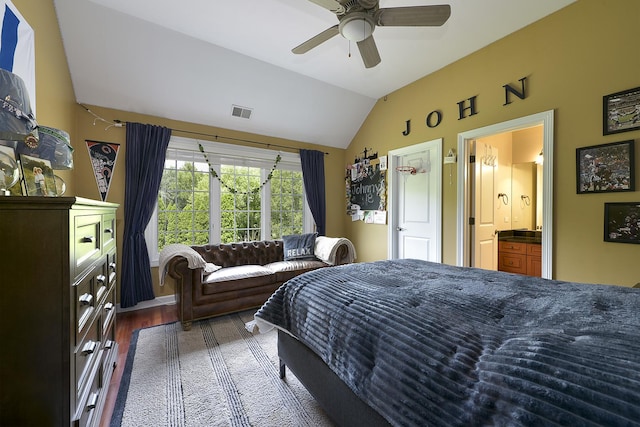 bedroom featuring visible vents, wood finished floors, connected bathroom, lofted ceiling, and ceiling fan