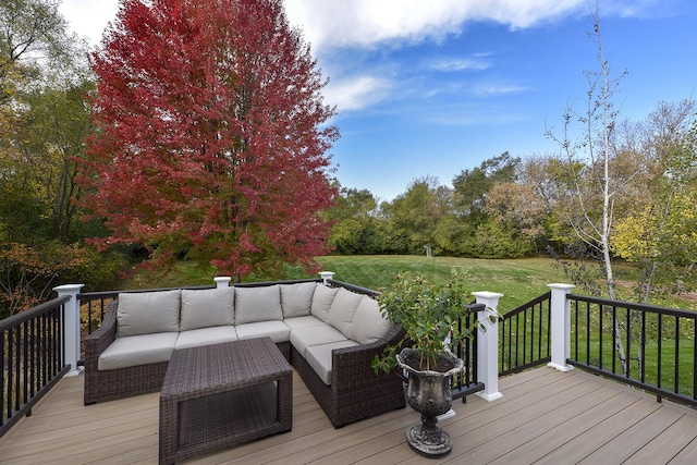 wooden terrace with a yard and outdoor lounge area