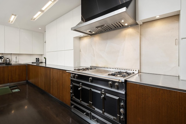 kitchen with stovetop, decorative backsplash, white cabinetry, exhaust hood, and modern cabinets